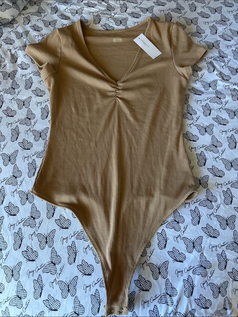 American Eagle Outfitters Ribbed V-Neck Bodysuit in Camel/Tan